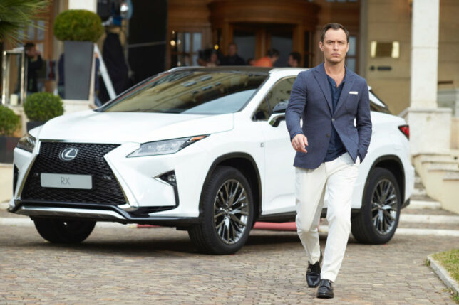 Jude Law poses with the Lexus RX