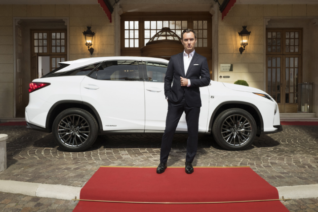 Jude Law poses with the Lexus RX