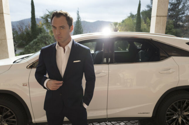 Jude Law poses with the Lexus RX