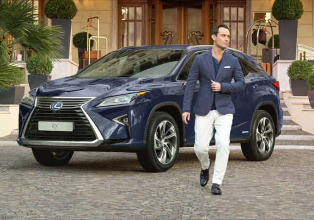 Jude Law poses with the Lexus RX