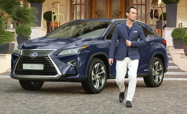 Jude Law poses with the Lexus RX